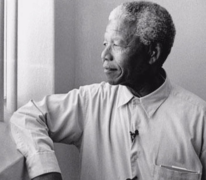 Nelson Mandela looking out of prison cell
